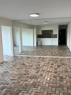 a view of a hallway with a kitchen