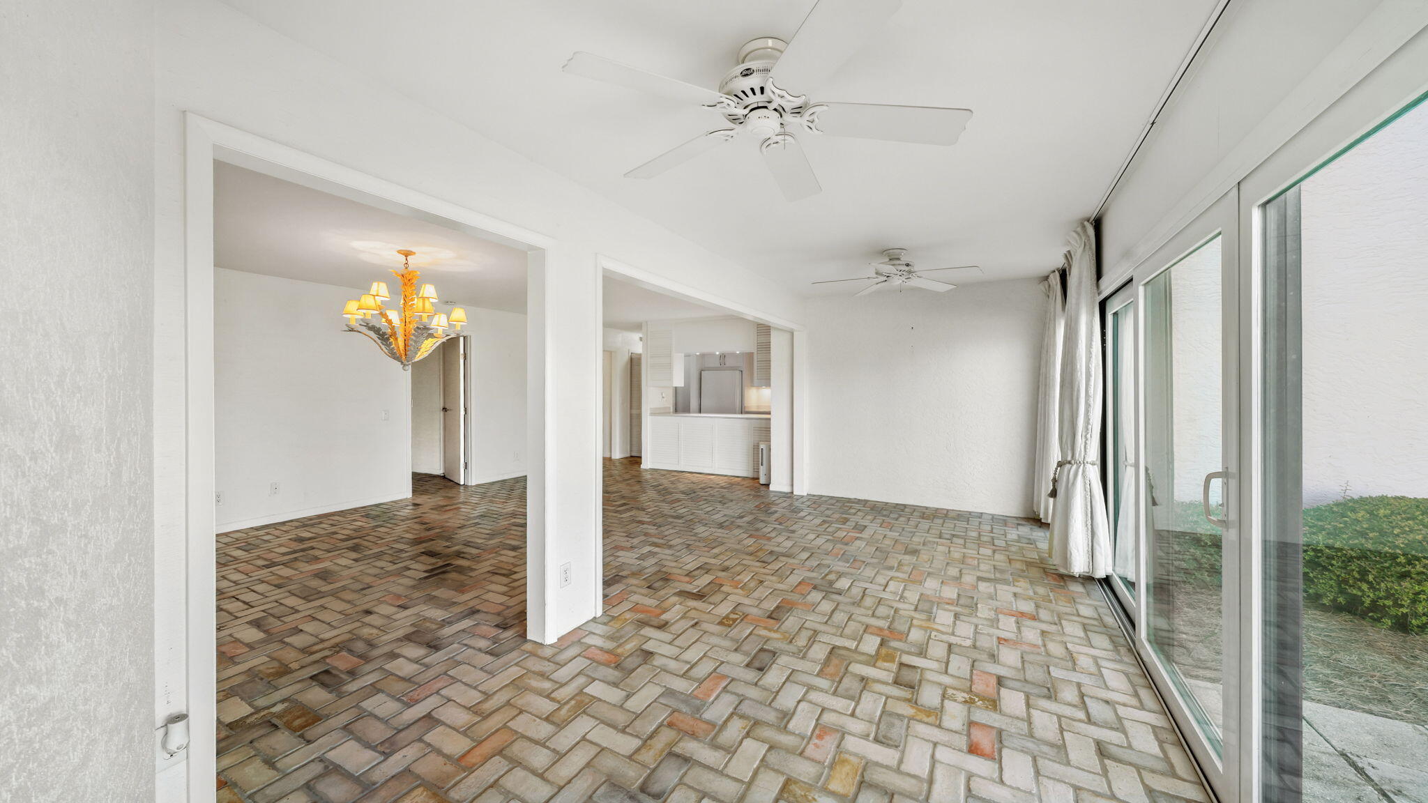 4725 Bay Point Road, Unit 166 Panama City Beach, FL 32408 - Photo 8 of 24 a view of a hallway with a chandelier