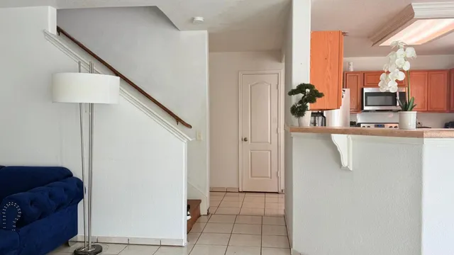a kitchen with stainless steel appliances a refrigerator and a sink