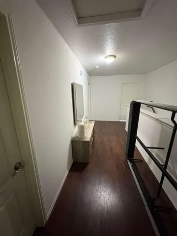 a view of a hallway with workspace