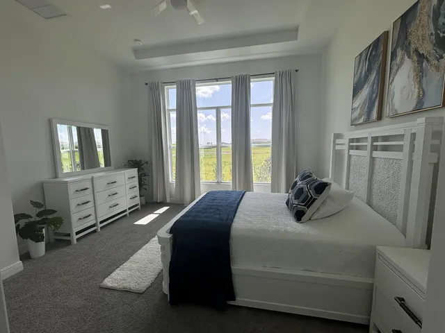a bathroom with a sink a vanity and large mirror