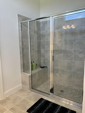 a large bathroom with a double vanity sink and a mirror