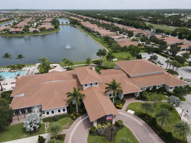 an aerial view of a house with a lake view