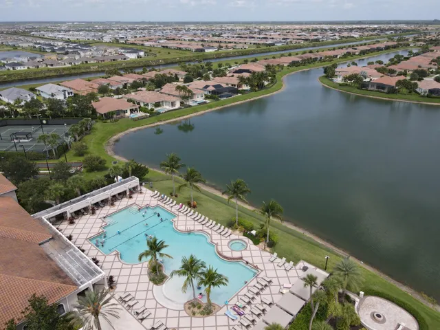 an aerial view of a house with a lake view