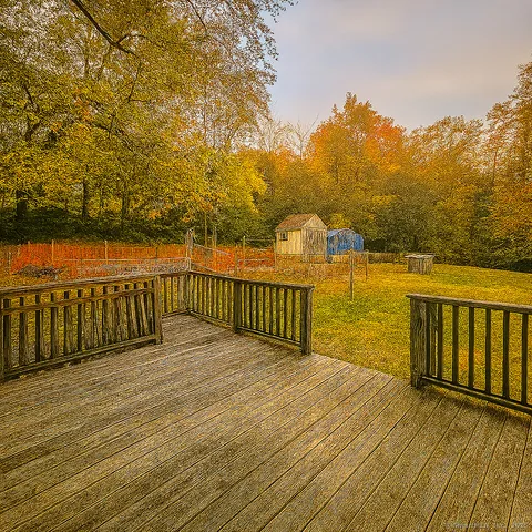 a view of wooden floor with a lake