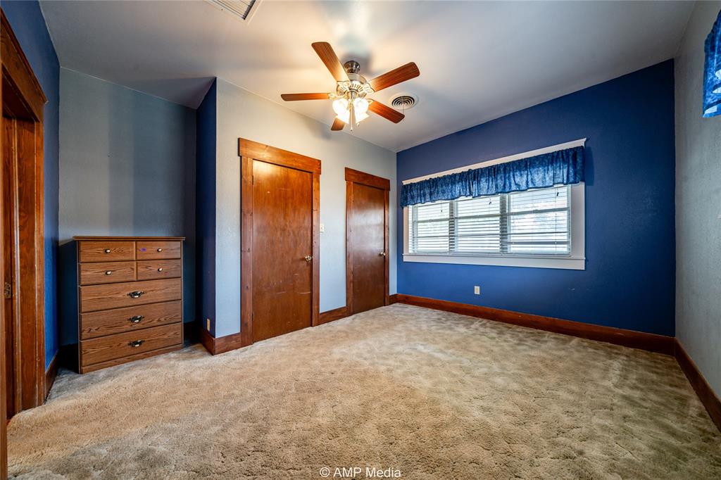 506 East Beauregard Street Rotan, TX 79546 - Photo 11 of 25 a view of an empty room with window and cabinet