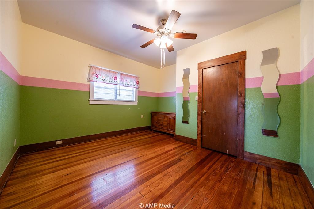 506 East Beauregard Street Rotan, TX 79546 - Photo 12 of 25 a view of room with window and ceiling fan