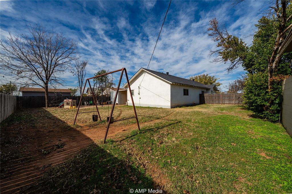 506 East Beauregard Street Rotan, TX 79546 - Photo 21 of 25 a house view with a backyard space