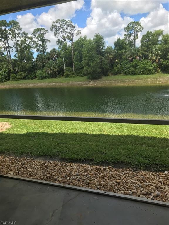 8245 Ibis Club Drive, Unit 409 Naples, FL 34104 - Photo 3 of 18 a view of a lake with a houses