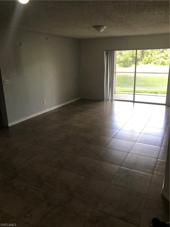 8245 Ibis Club Drive, Unit 409 Naples, FL 34104 - Photo 8 of 18 a view of an empty room with a window