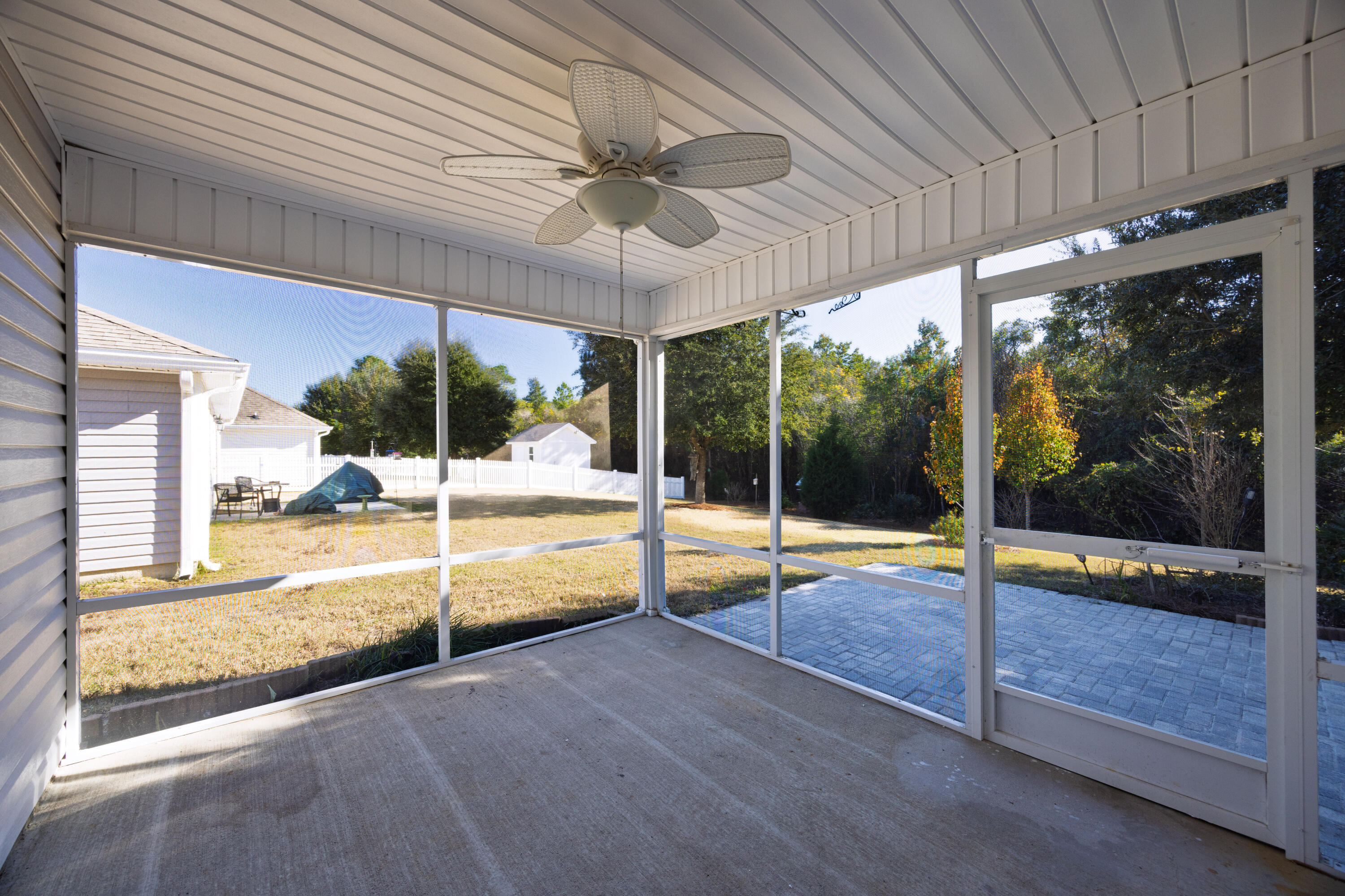 617 Fanny Ann Way Freeport, FL 32439 - Photo 16 of 21 a view of a patio with a table and chairs under an umbrella