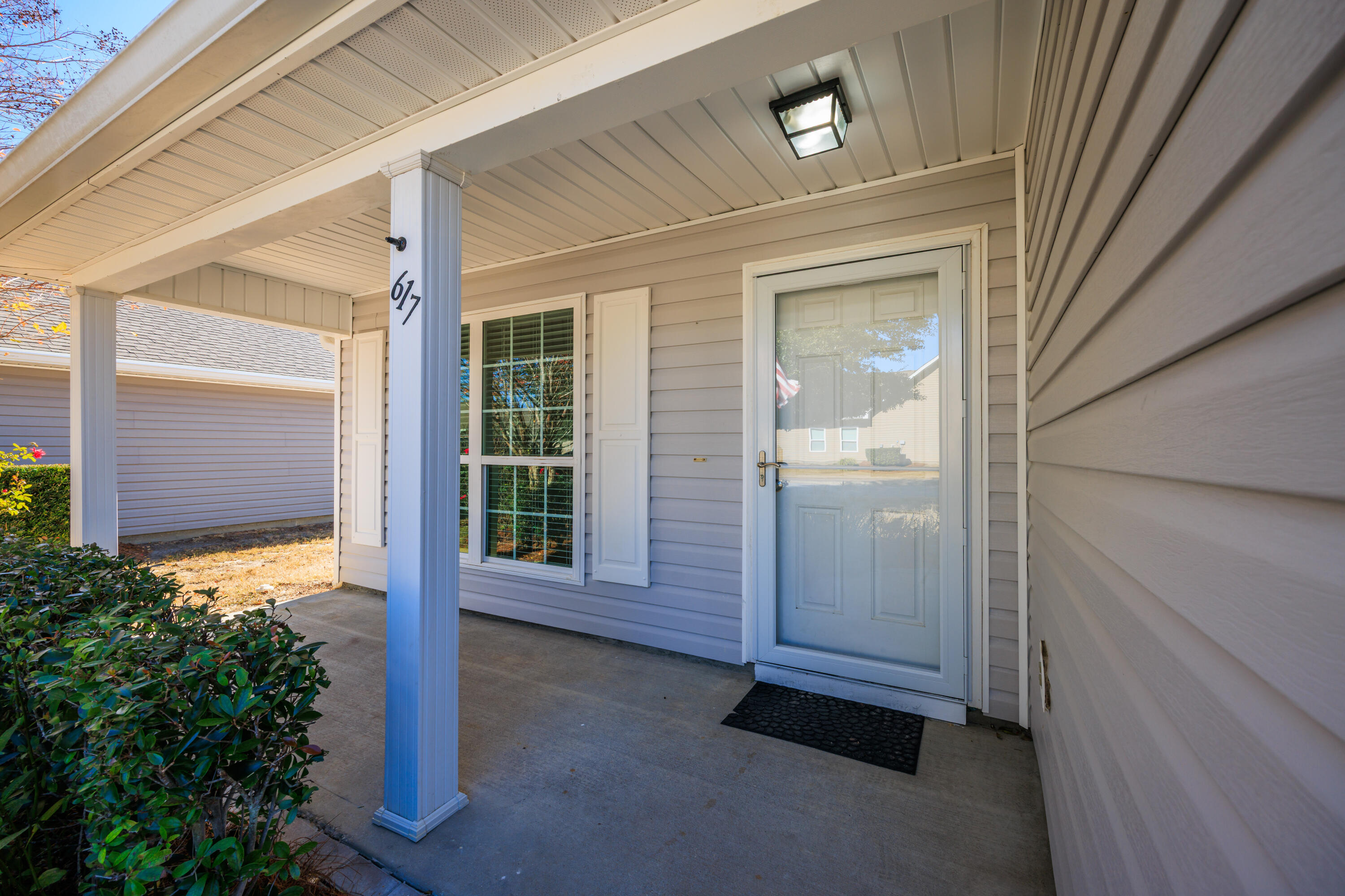 617 Fanny Ann Way Freeport, FL 32439 - Photo 3 of 21 a front view of a house with a plants
