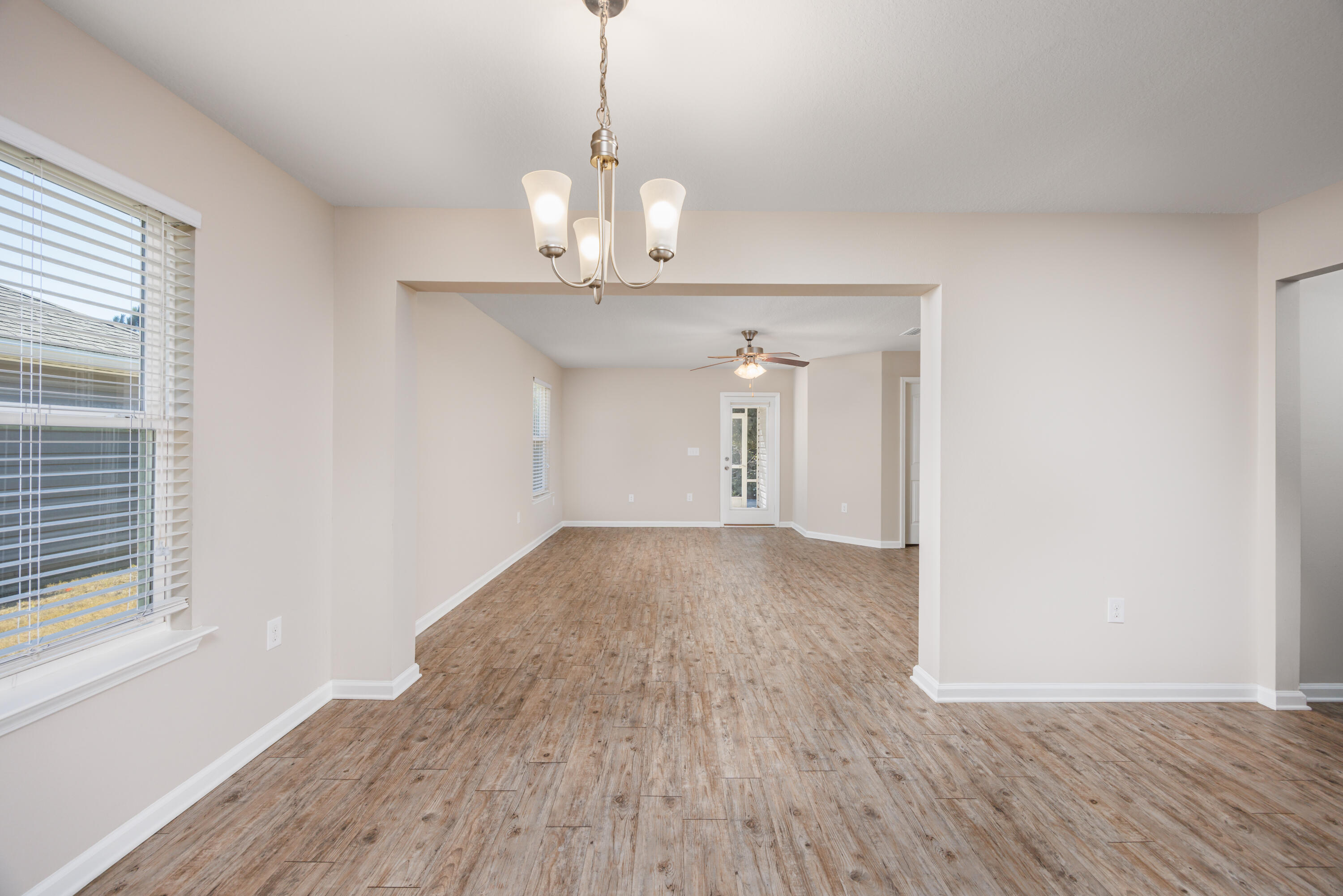 617 Fanny Ann Way Freeport, FL 32439 - Photo 6 of 21 a view of empty room with wooden floor and window