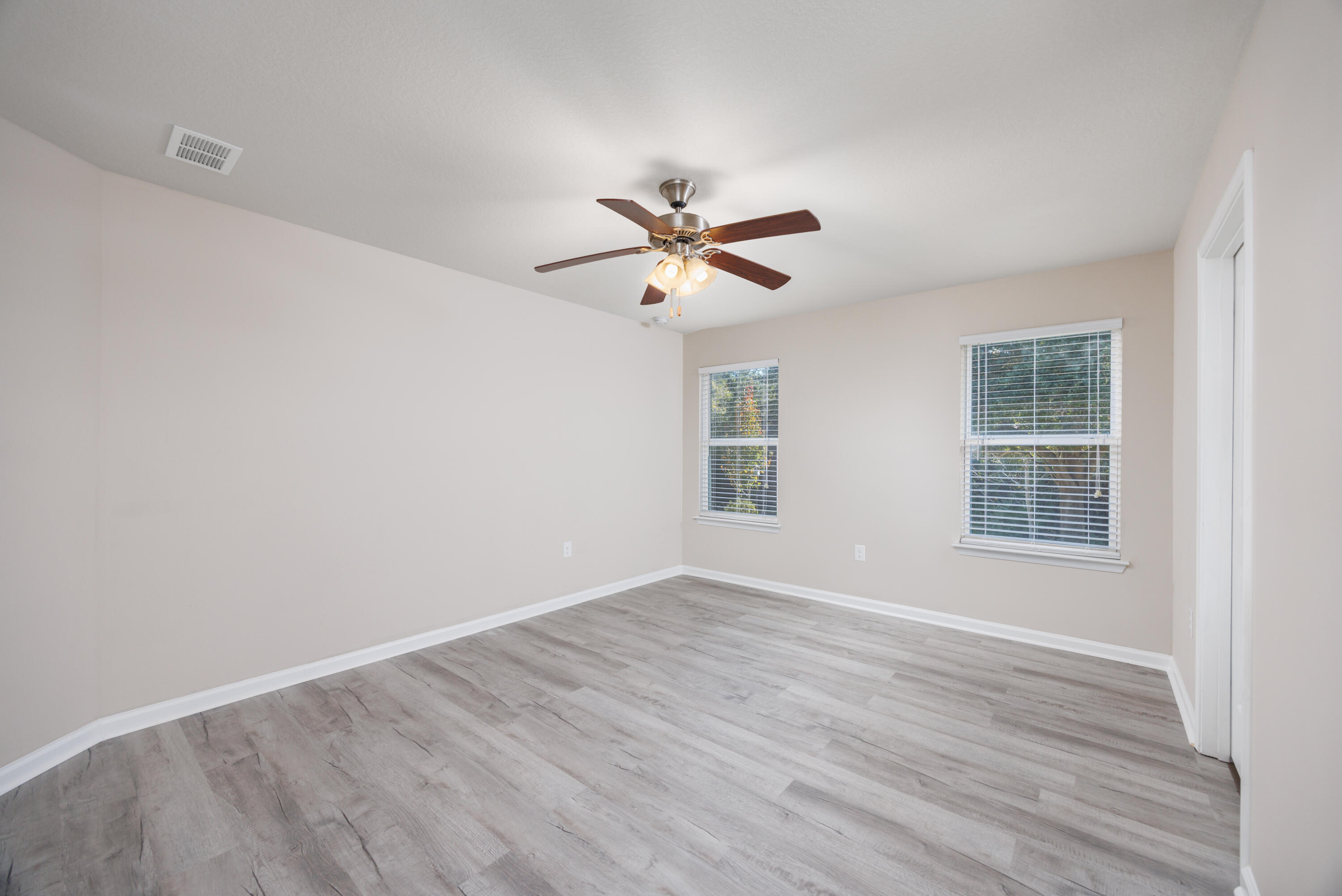 617 Fanny Ann Way Freeport, FL 32439 - Photo 8 of 21 wooden floor in an empty room with a window