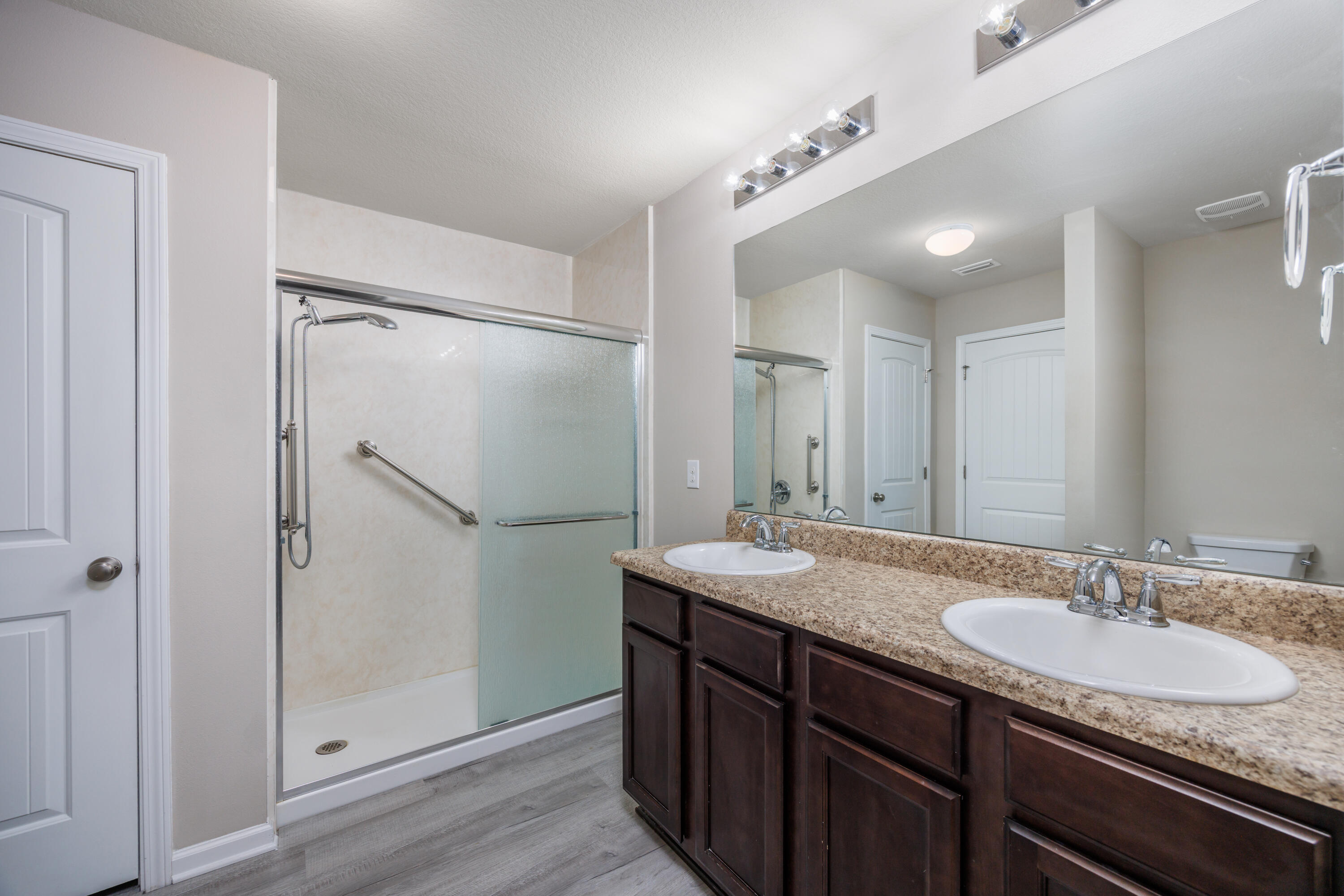 617 Fanny Ann Way Freeport, FL 32439 - Photo 10 of 21 a bathroom with a granite countertop shower sink and mirror