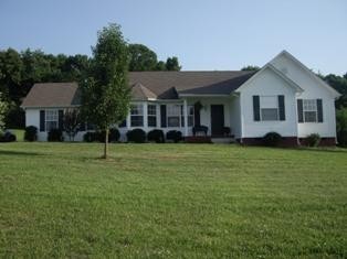 523 D V Circle Spring Hill, TN 37174 - Photo 1 of 10 a front view of house with yard and green space