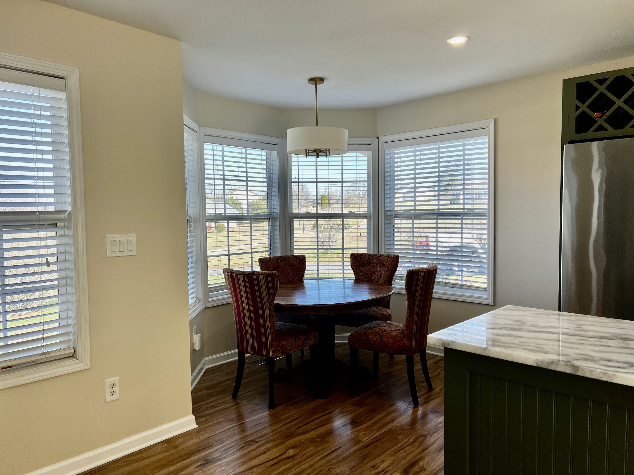 523 D V Circle Spring Hill, TN 37174 - Photo 5 of 10 a view of a dining room with furniture window and wooden floor