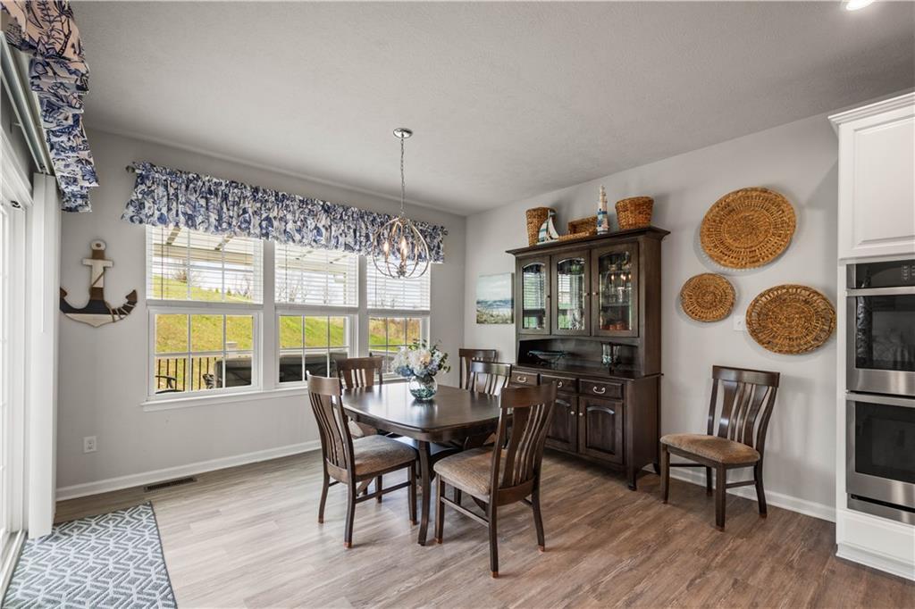 107 High Pointe Drive Washington, PA 15301 - Photo 15 of 38 a view of a dining room with furniture window and wooden floor
