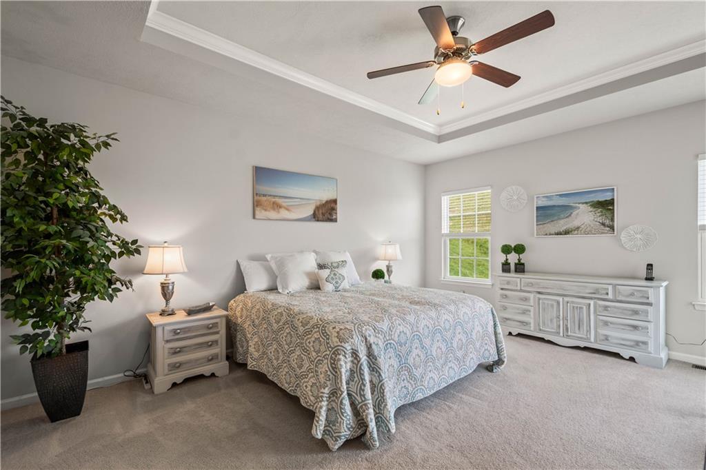 107 High Pointe Drive Washington, PA 15301 - Photo 17 of 38 a bedroom with a large bed and a chandelier fan
