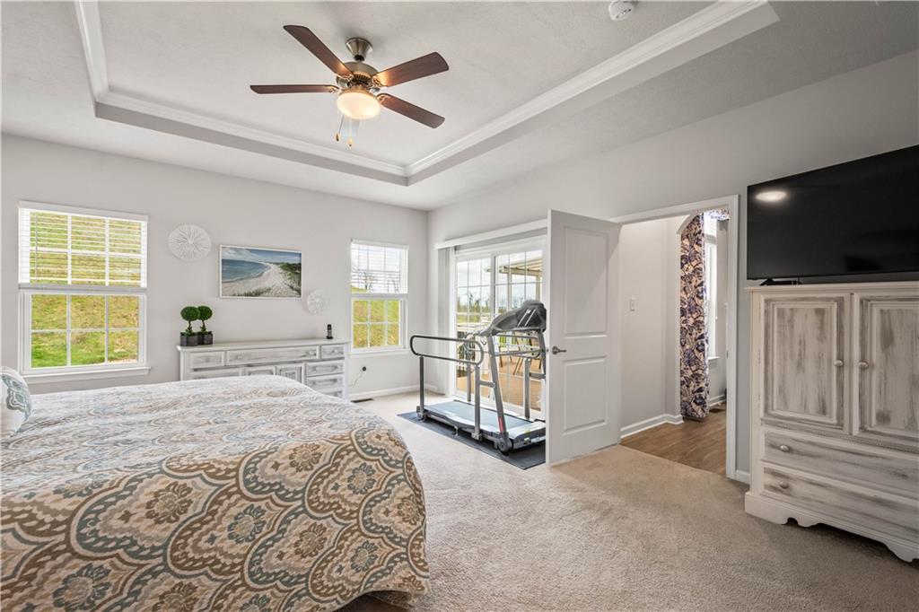 107 High Pointe Drive Washington, PA 15301 - Photo 19 of 38 a spacious bedroom with a bed and a flat screen tv