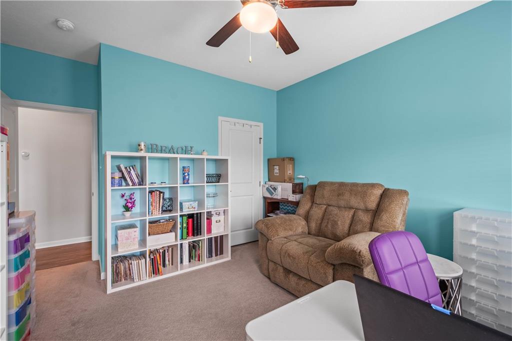 107 High Pointe Drive Washington, PA 15301 - Photo 23 of 38 a living room with furniture and a book shelf