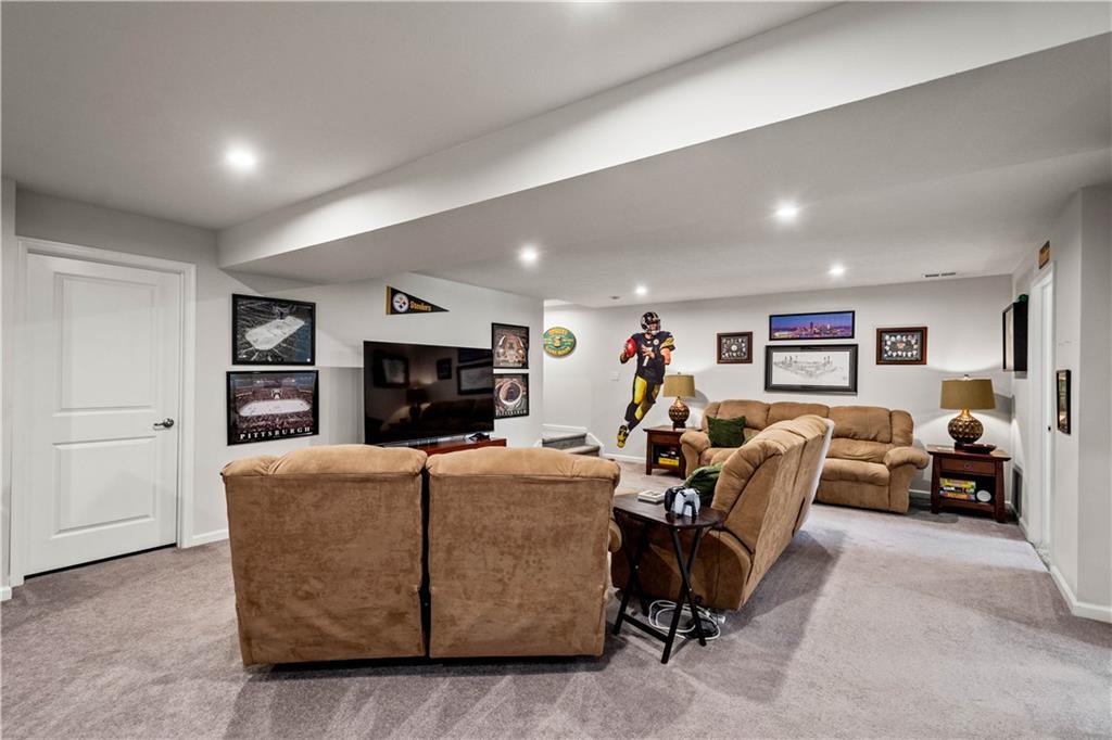 107 High Pointe Drive Washington, PA 15301 - Photo 27 of 38 a living room with furniture and a fireplace