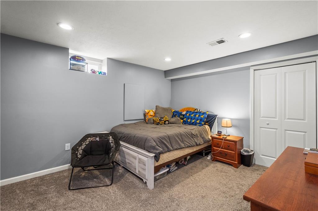 107 High Pointe Drive Washington, PA 15301 - Photo 28 of 38 a bedroom with a bed and a chair