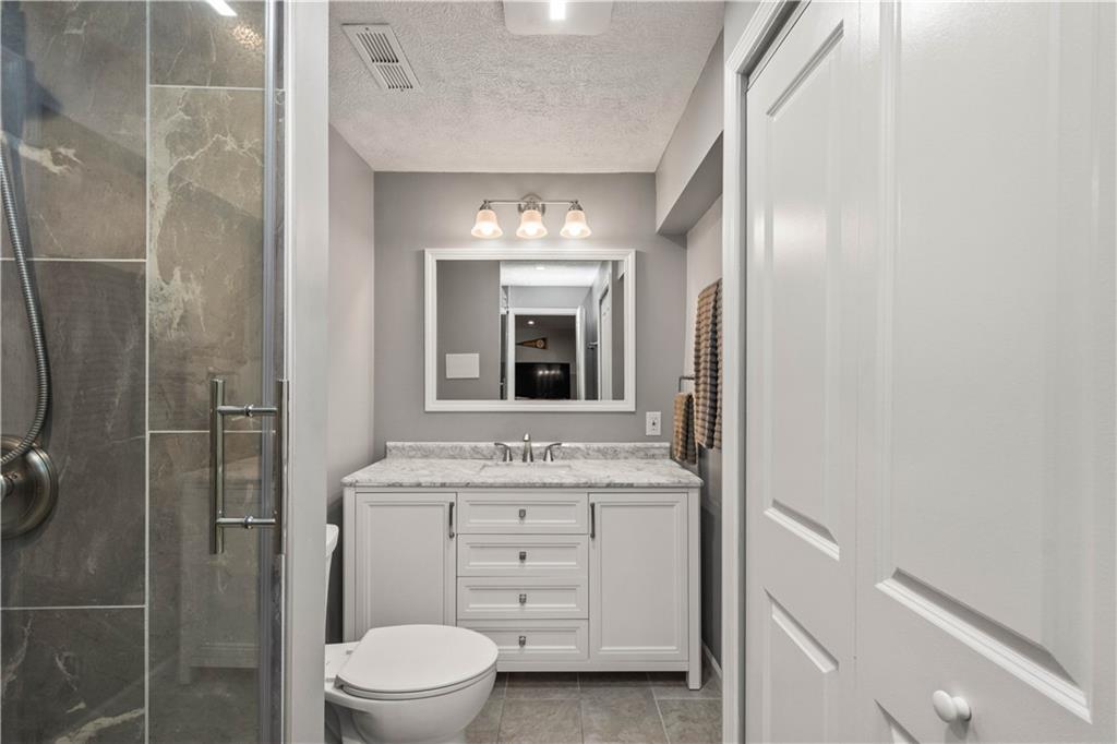 107 High Pointe Drive Washington, PA 15301 - Photo 30 of 38 a bathroom with a toilet sink and mirror