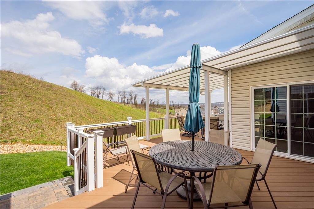 107 High Pointe Drive Washington, PA 15301 - Photo 4 of 38 a view of a patio with table and chairs and potted plants