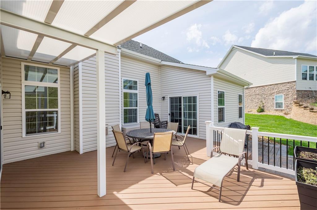 107 High Pointe Drive Washington, PA 15301 - Photo 6 of 38 a outdoor space with patio the couches and a dining table with wooden floor