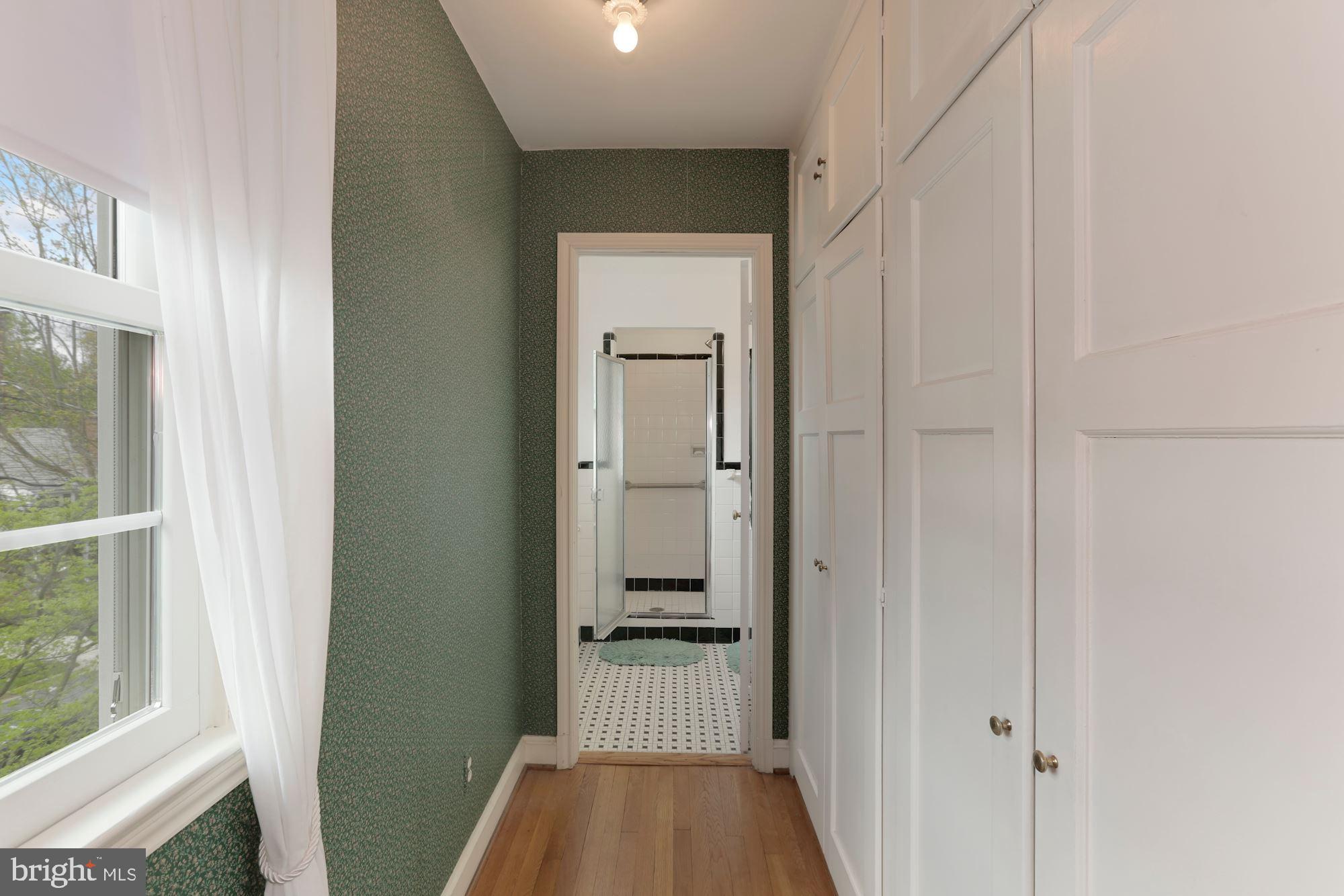 5615 Overlea Road Bethesda, MD 20816 - Photo 23 of 48 Front hall to primary bath, closets to the right.