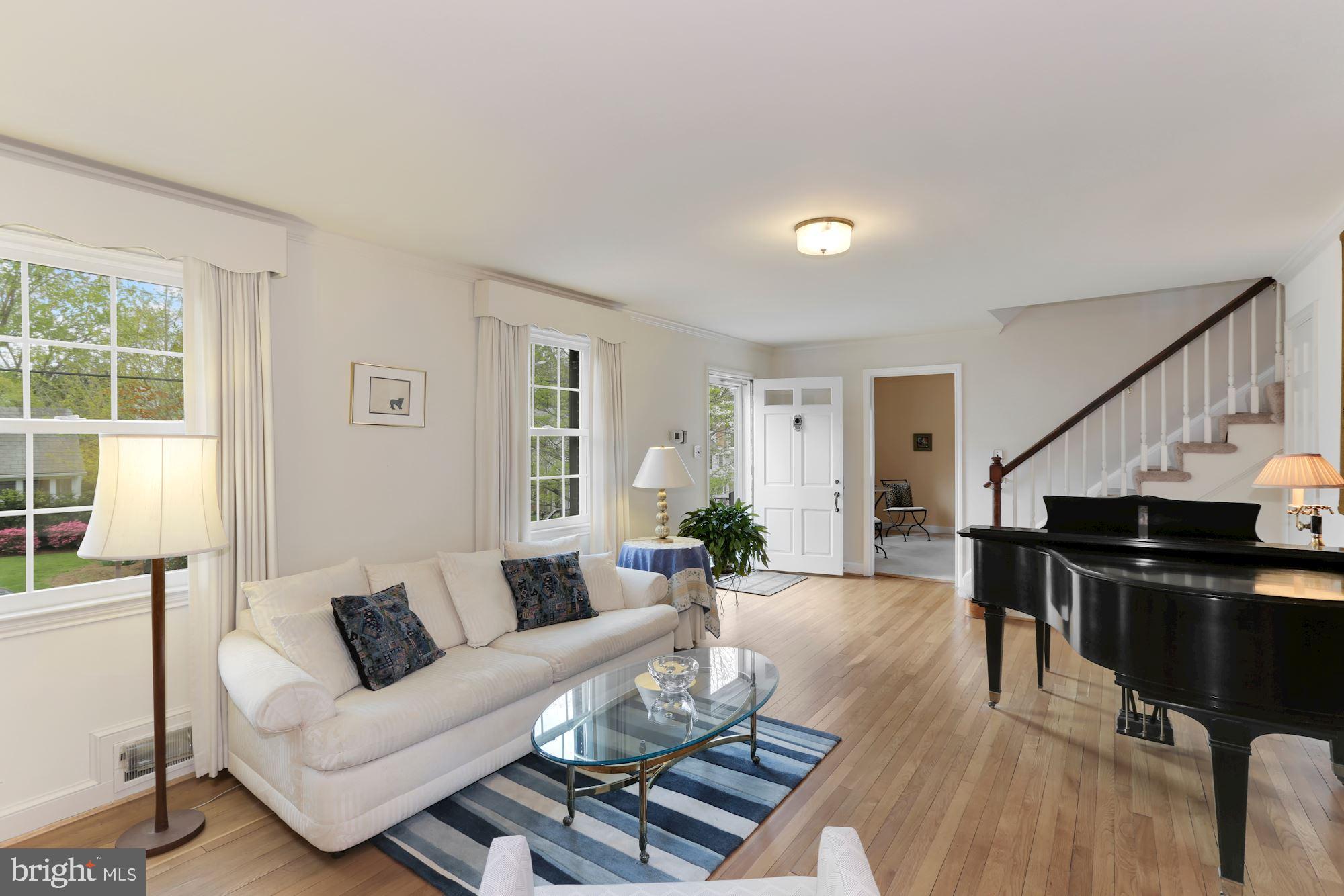 5615 Overlea Road Bethesda, MD 20816 - Photo 4 of 48 Large living room with warm, light hardwood floors