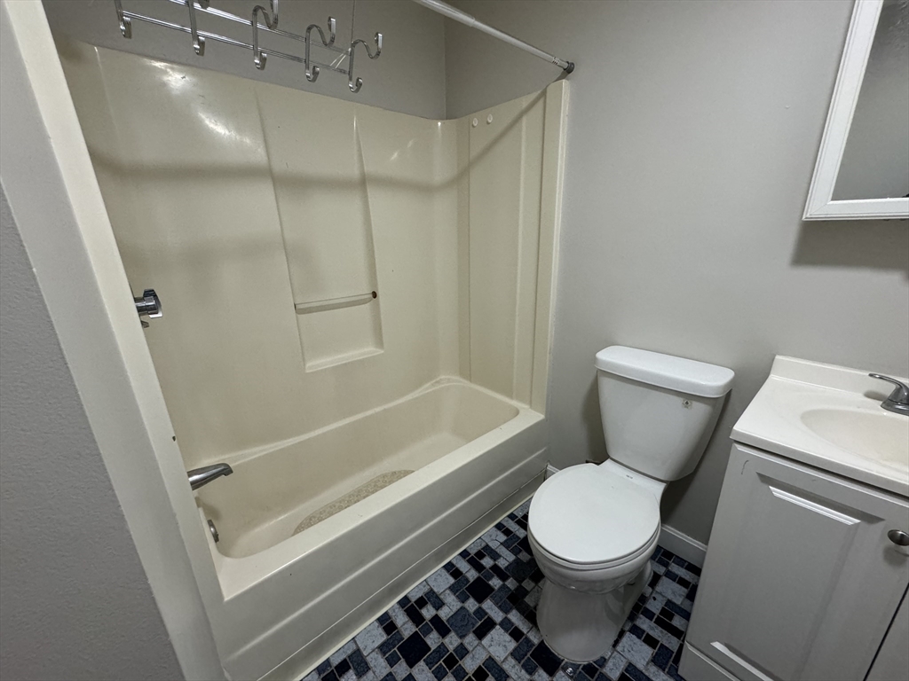 138 Franklin Street, Unit 3 Lynn, MA 01902 - Photo 10 of 11 a bathroom with a toilet and a shower