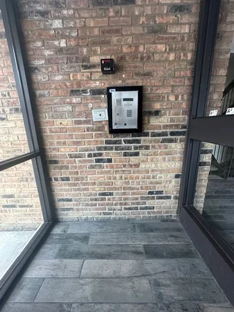 a view of front door of house with wooden floor
