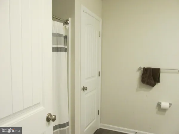 a bathroom with a shower and a sink