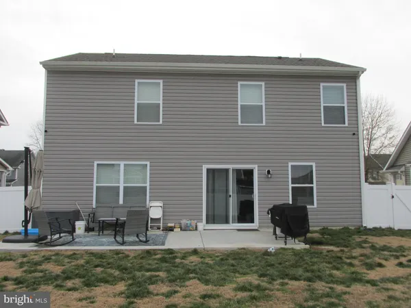 a front view of house with yard and seating space