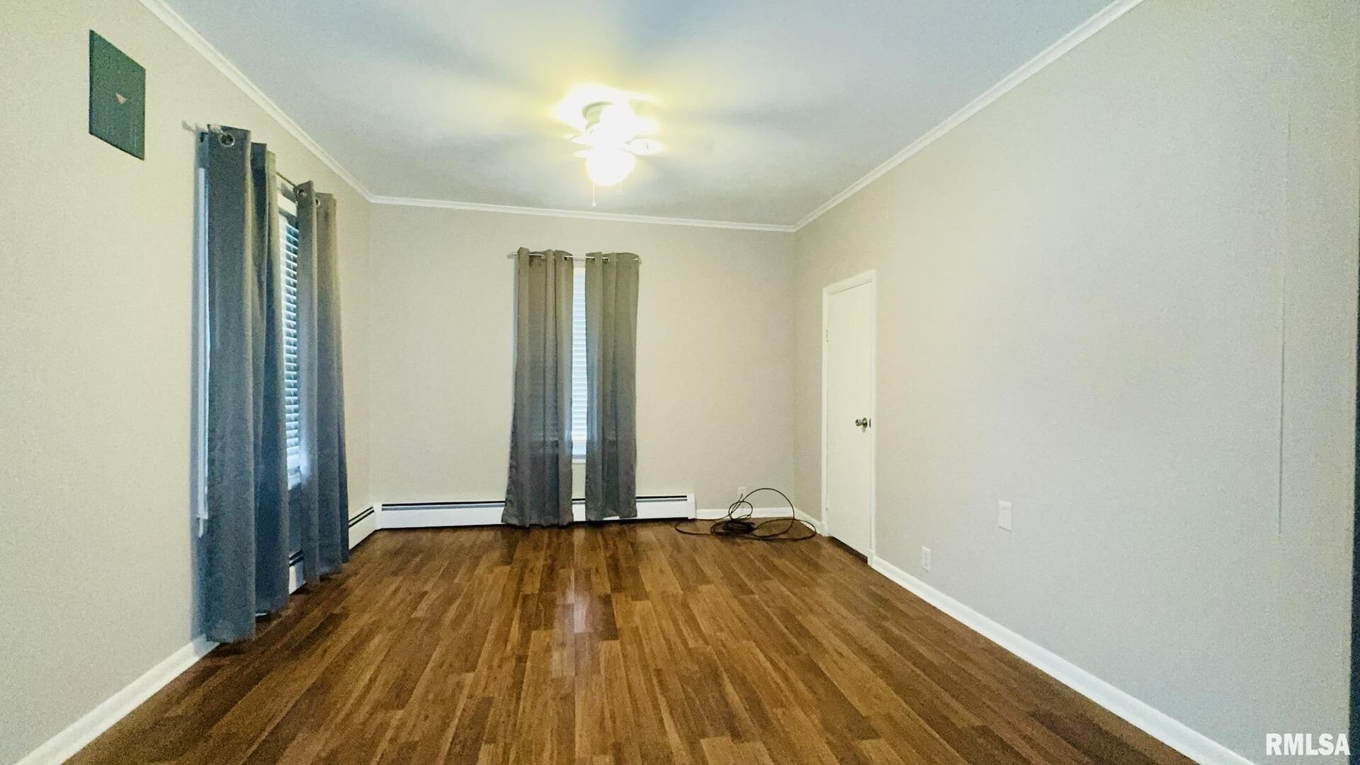 1206 South Main Street Benton, IL 62812 - Photo 12 of 23 a view of a room with wooden floor and brick walls