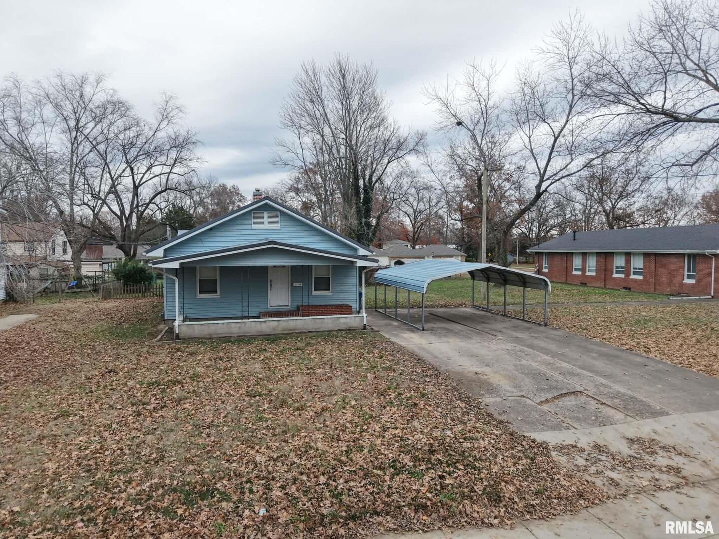 1206 South Main Street Benton, IL 62812 - Photo 5 of 23 a front view of a house with a yard
