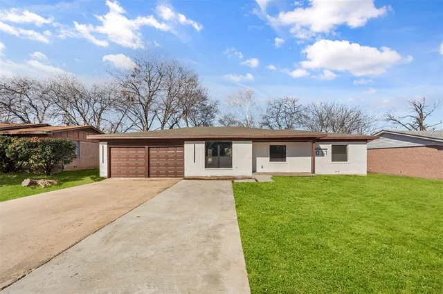 a front view of a house with yard