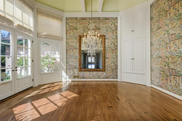 a living room with furniture a fireplace and a table