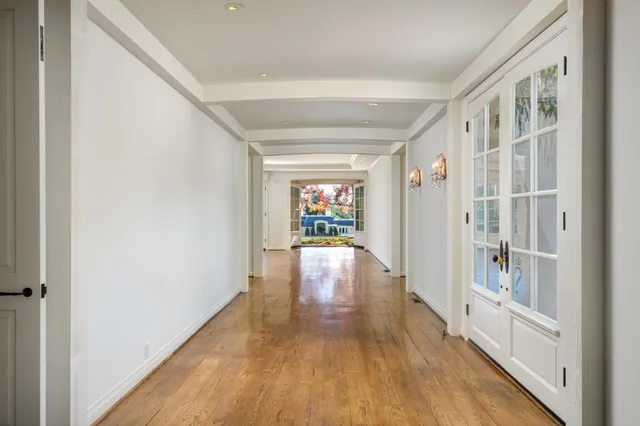 a spacious bathroom with a granite countertop sink mirror and bathtub