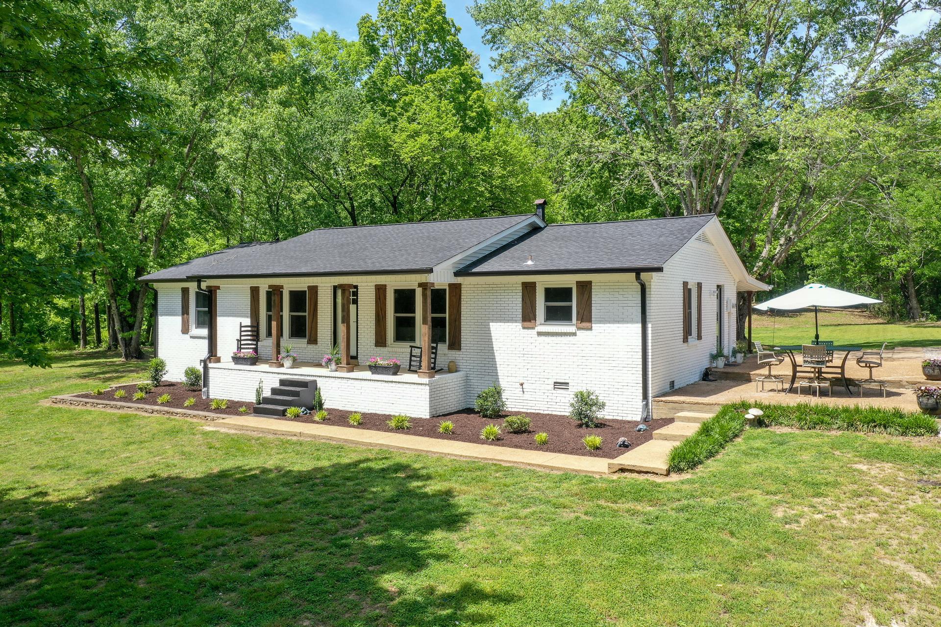 2361 Joe Brown Road Spring Hill, TN 37174 - Photo 1 of 27 a view of a house with a yard patio and a small yard
