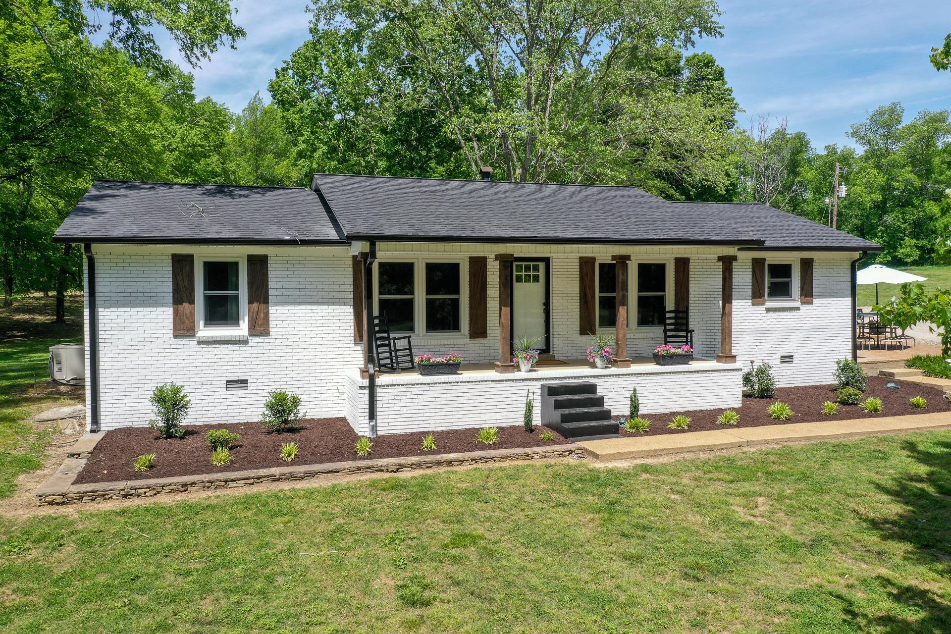 2361 Joe Brown Road Spring Hill, TN 37174 - Photo 2 of 27 a view of a house with backyard and sitting area