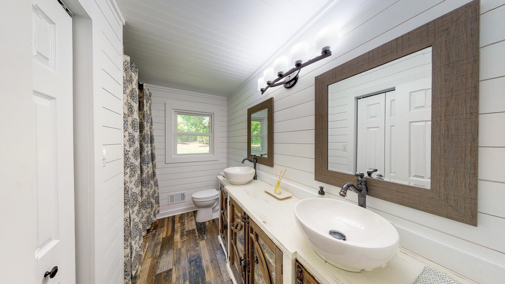 2361 Joe Brown Road Spring Hill, TN 37174 - Photo 12 of 27 a bathroom with a sink and a mirror