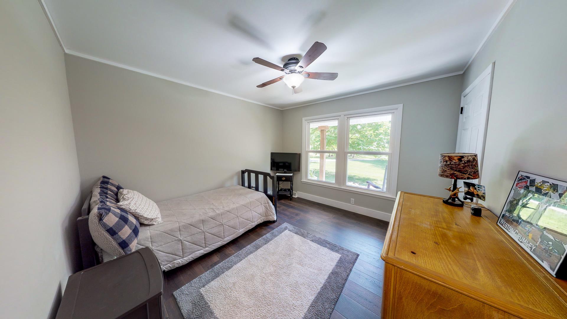 2361 Joe Brown Road Spring Hill, TN 37174 - Photo 14 of 27 a bed room with furniture and a window