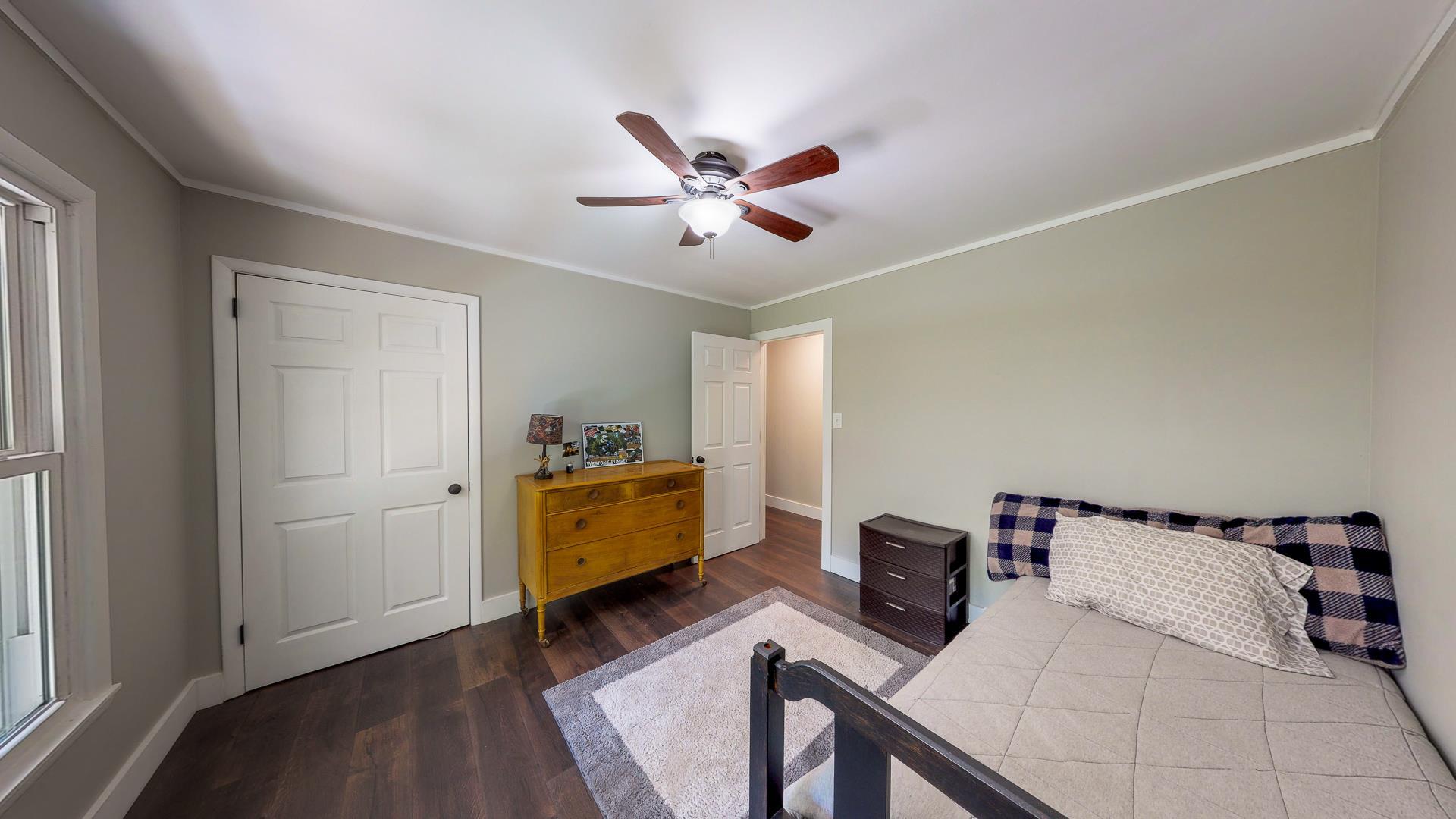2361 Joe Brown Road Spring Hill, TN 37174 - Photo 15 of 27 a bed room with a bed and a chandelier