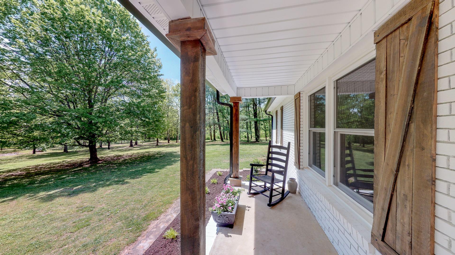 2361 Joe Brown Road Spring Hill, TN 37174 - Photo 4 of 27 a porch with a garden view