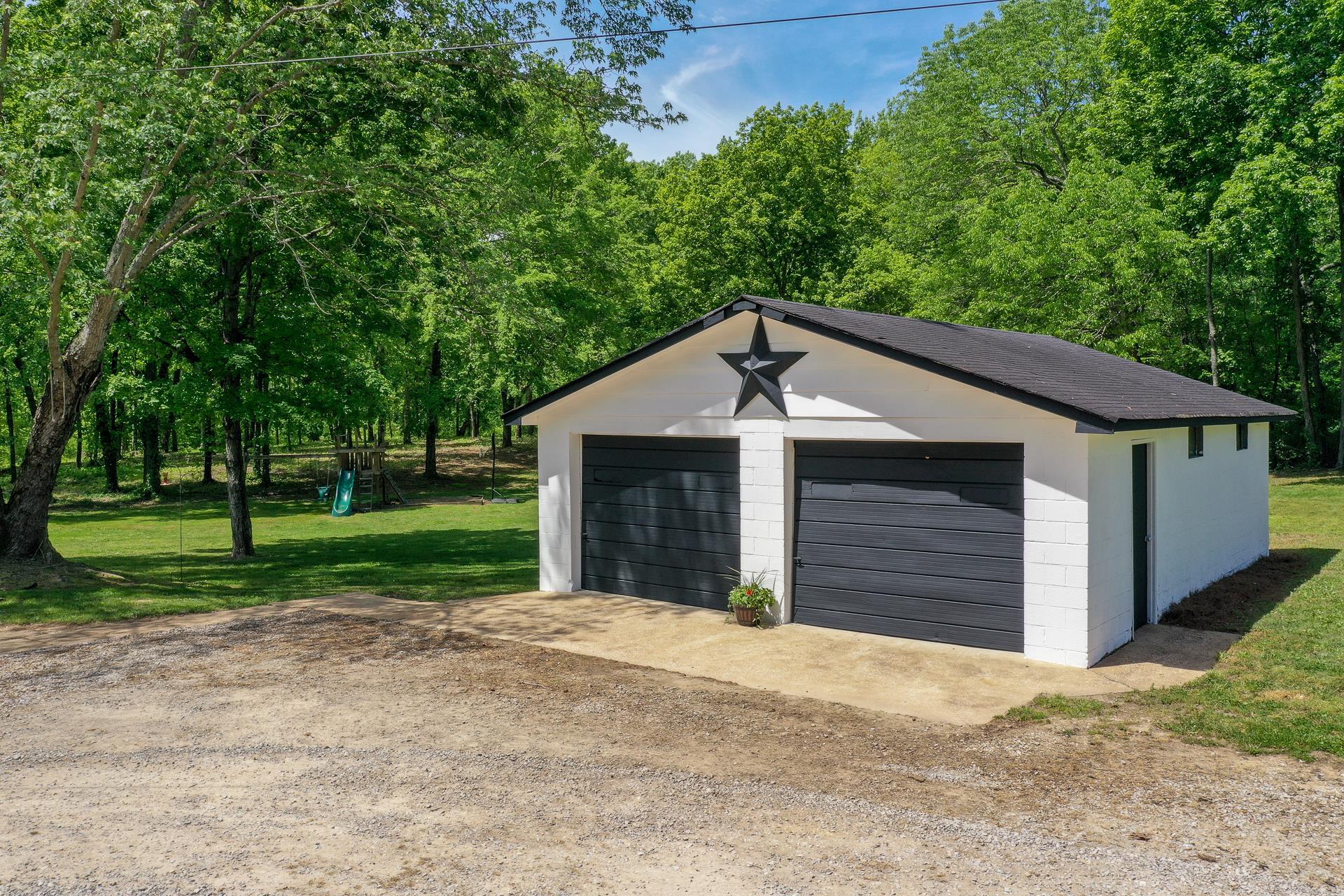 2361 Joe Brown Road Spring Hill, TN 37174 - Photo 5 of 27 a house with a yard