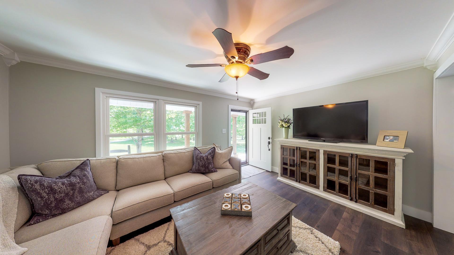 2361 Joe Brown Road Spring Hill, TN 37174 - Photo 6 of 27 a living room with furniture and a flat screen tv