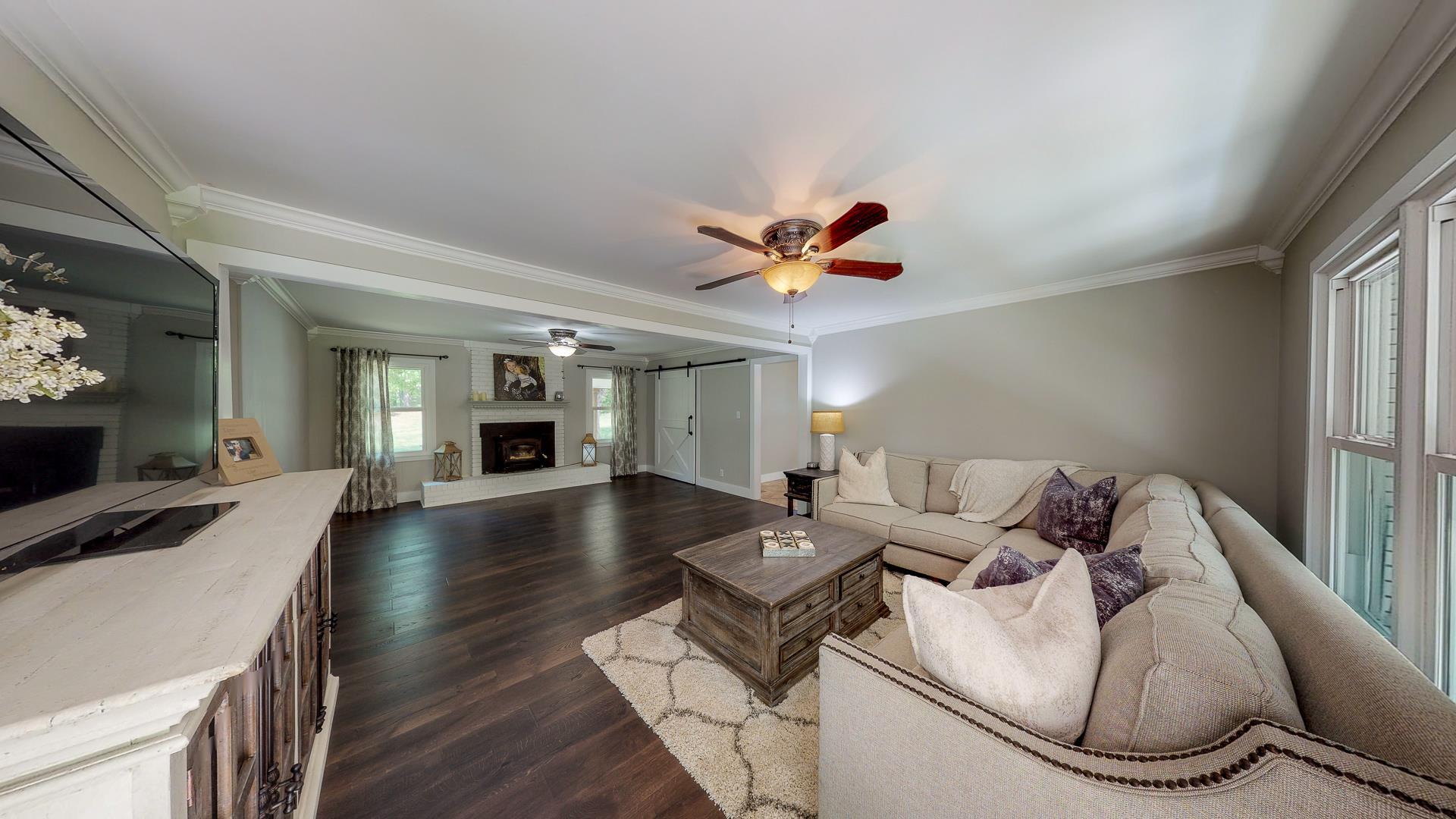 2361 Joe Brown Road Spring Hill, TN 37174 - Photo 9 of 27 a living room with furniture and a wooden floor